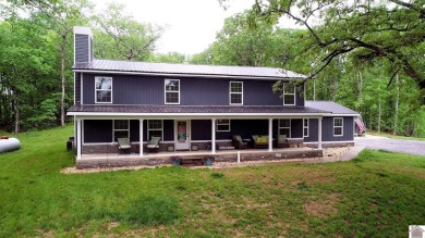 Beautifully updated 5-bed/3-bath home situated on 2.35 acres in - Lake Home For Sale in Murray, Kentucky