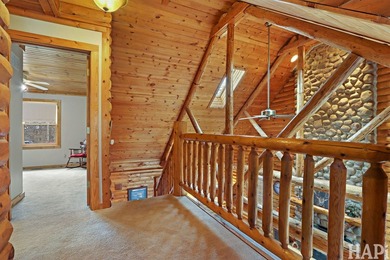 Welcome to this beautiful waterfront log home tucked away on a - photo 13