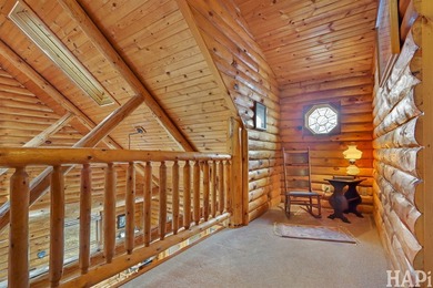Welcome to this beautiful waterfront log home tucked away on a - photo 14