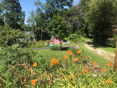 Welcome to this beautiful waterfront log home tucked away on a - photo 26