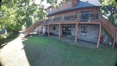Welcome to this beautiful waterfront log home tucked away on a - photo 27
