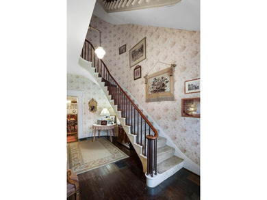 A remarkable historic brick home welcomes guests through - photo 6