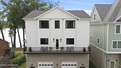 Experience elevated riverfront living in this striking - photo 3