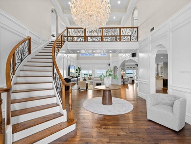 Welcome to an extraordinary waterfront estate in the prestigious - photo 5