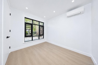 Welcome to this beautifully renovated two family home in the - photo 12