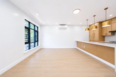 Welcome to this beautifully renovated two family home in the - photo 15