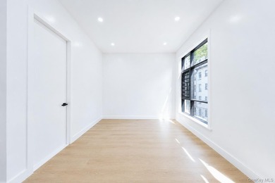 Welcome to this beautifully renovated two family home in the - photo 16