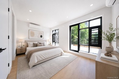 Welcome to this beautifully renovated two family home in the - photo 17