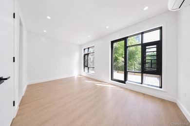 Welcome to this beautifully renovated two family home in the - photo 18