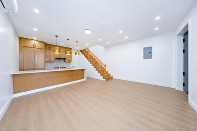 Welcome to this beautifully renovated two family home in the - photo 19