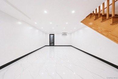 Welcome to this beautifully renovated two family home in the - photo 22