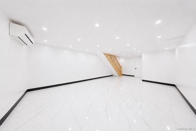 Welcome to this beautifully renovated two family home in the - photo 24