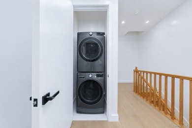 Welcome to this beautifully renovated two family home in the - photo 25