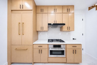 Welcome to this beautifully renovated two family home in the - photo 26