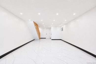 Welcome to this beautifully renovated two family home in the - photo 27