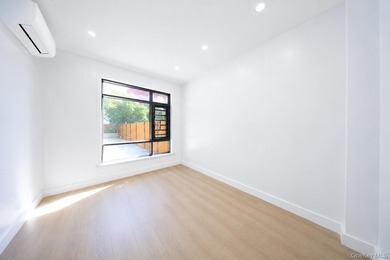 Welcome to this beautifully renovated two family home in the - photo 30
