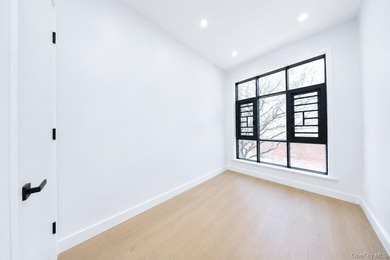 Welcome to this beautifully renovated two family home in the - photo 32