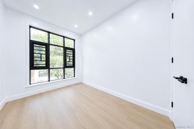 Welcome to this beautifully renovated two family home in the - photo 35