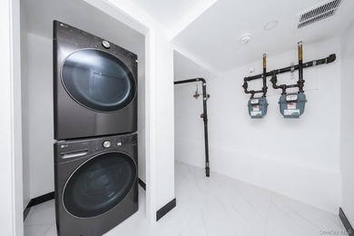 Welcome to this beautifully renovated two family home in the - photo 37