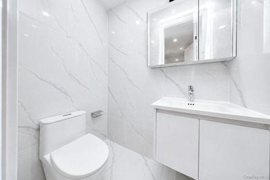 Welcome to this beautifully renovated two family home in the - photo 38