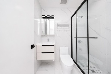 Welcome to this beautifully renovated two family home in the - photo 39