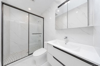 Welcome to this beautifully renovated two family home in the - photo 40