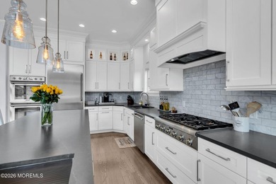 Welcome to this stunning 4-bedroom, 3 1/2-bath waterfront home - photo 6