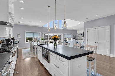 Welcome to this stunning 4-bedroom, 3 1/2-bath waterfront home - photo 7