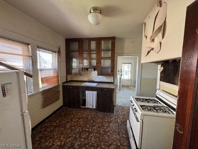 Investment Opportunity in this cape cod style home on the - photo 9