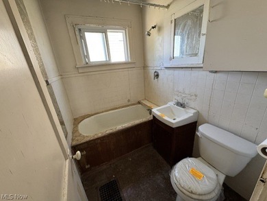 Investment Opportunity in this cape cod style home on the - photo 10