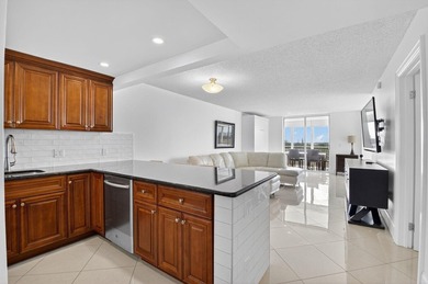 Pristine and fully updated, this penthouse-level 1-bedroom plus - photo 1
