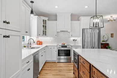 Luxury, low-maintenance living meets peaceful wooded privacy in - photo 11