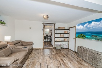 Welcome to this well-maintained three-family home in the highly - photo 11