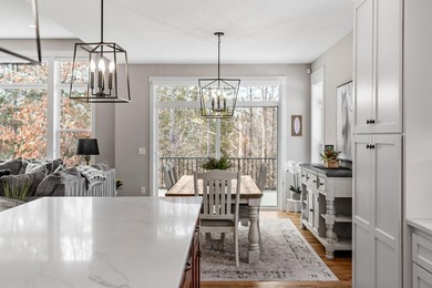 Luxury, low-maintenance living meets peaceful wooded privacy in - photo 12