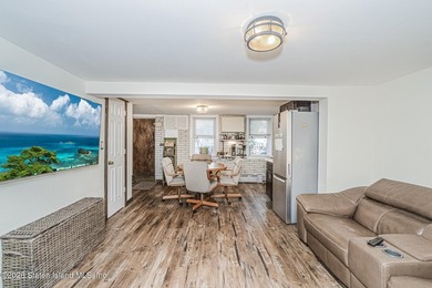 Welcome to this well-maintained three-family home in the highly - photo 12