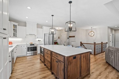 Luxury, low-maintenance living meets peaceful wooded privacy in - photo 17