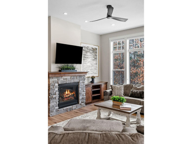 Luxury, low-maintenance living meets peaceful wooded privacy in - photo 22
