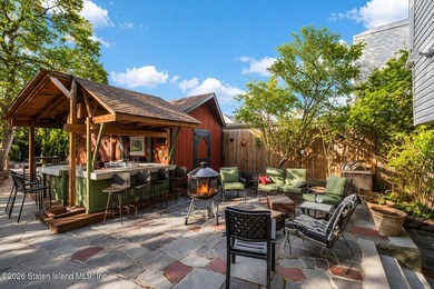 Welcome to this well-maintained three-family home in the highly - photo 26