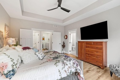 Luxury, low-maintenance living meets peaceful wooded privacy in - photo 29