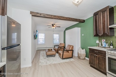 Welcome to this well-maintained three-family home in the highly - photo 34