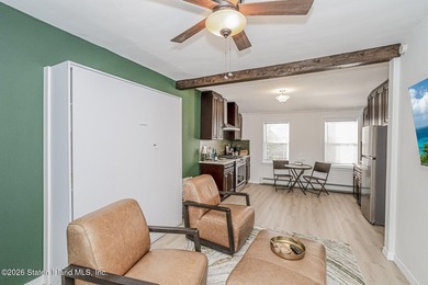 Welcome to this well-maintained three-family home in the highly - photo 35