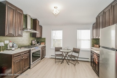 Welcome to this well-maintained three-family home in the highly - photo 36