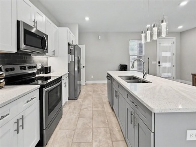 Built in 2023, this true 4-bedroom, 2-bath home with a two-car - photo 3