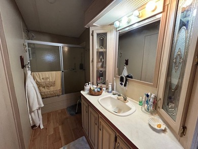 This 1995 manufactured home features 2 bedrooms and 2 bathrooms - photo 11
