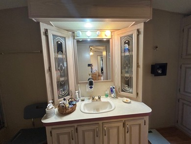 This 1995 manufactured home features 2 bedrooms and 2 bathrooms - photo 12