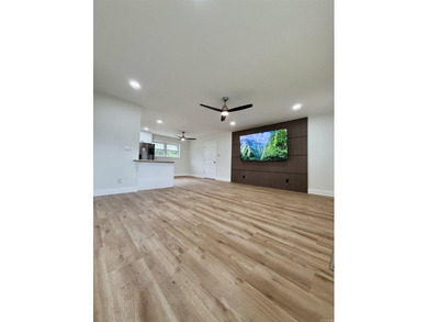 This updated 4-bed, 2-bath home in the highly desired Lake - photo 2