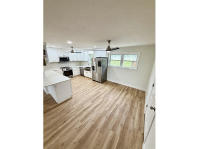 This updated 4-bed, 2-bath home in the highly desired Lake - photo 4