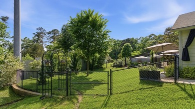 A serene 12 acres of lush pastureland and mature trees, this - photo 26