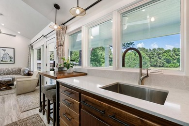 A serene 12 acres of lush pastureland and mature trees, this - photo 30