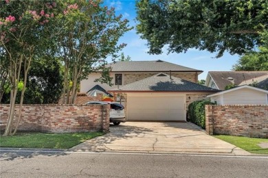 Welcome to this stunning two-story brick home in the highly